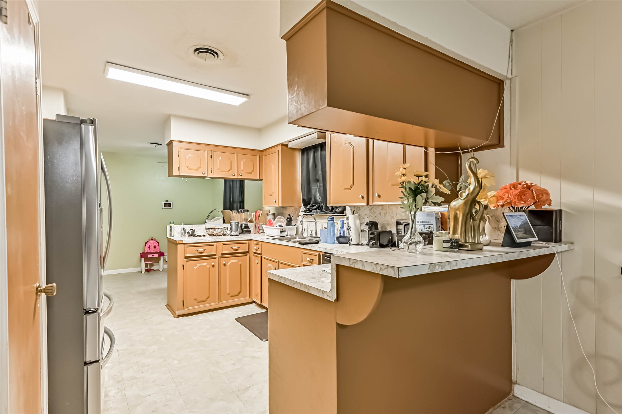 103 Deaton Street Freeport, TX 77541 - Photo 11 of 25 a kitchen with a sink cabinets and window