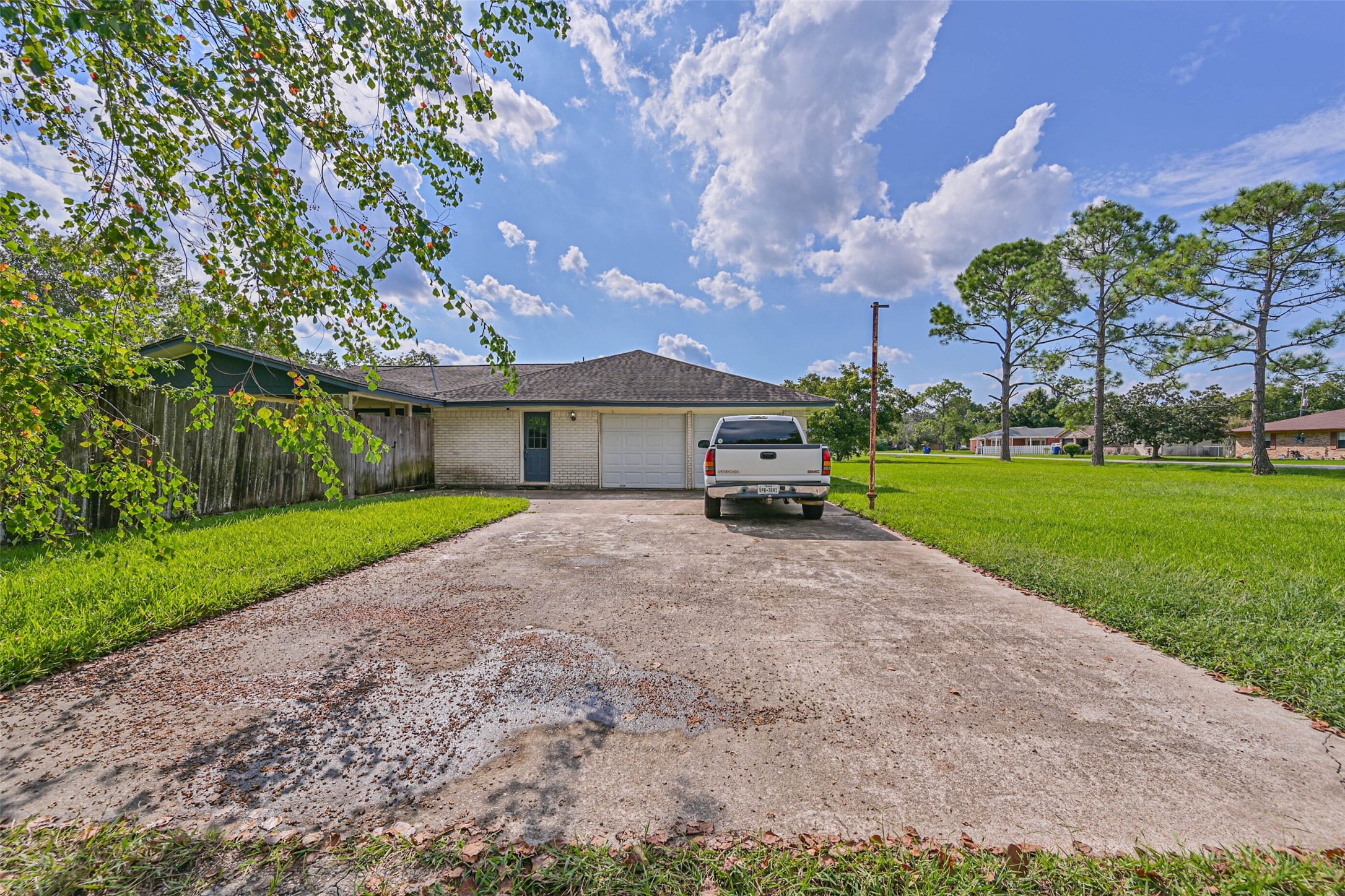 103 Deaton Street Freeport, TX 77541 - Photo 4 of 25 a front view of a house with a yard and garage