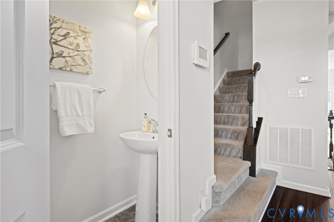 7849 Chasing Lane Richmond, VA 23237 - Photo 17 of 29 Bathroom with baseboards and dark wood-type floori