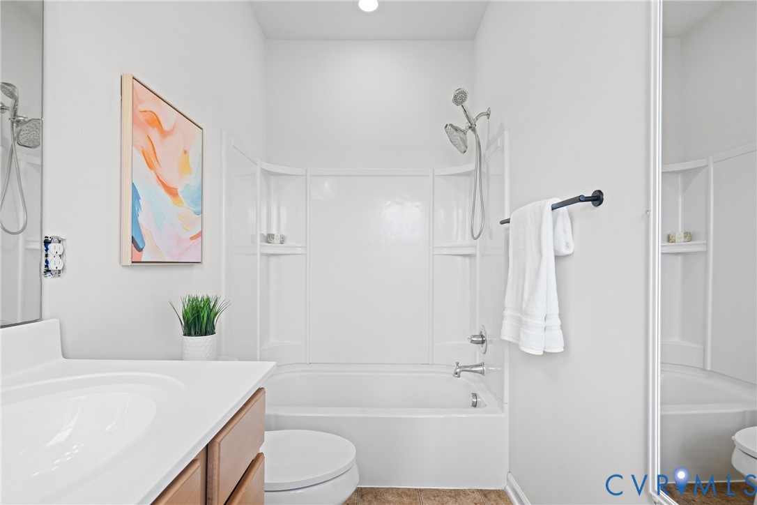 7849 Chasing Lane Richmond, VA 23237 - Photo 22 of 29 Bathroom featuring tub / shower combination, vanit