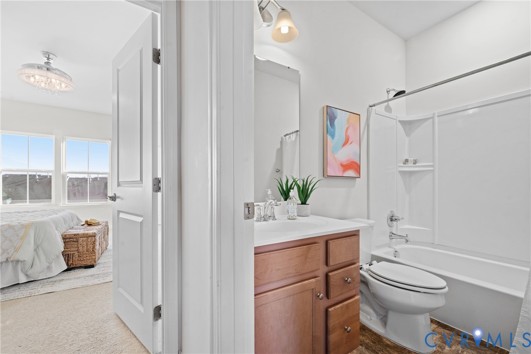 7849 Chasing Lane Richmond, VA 23237 - Photo 23 of 29 Bathroom with vanity, shower / bath combo with sho