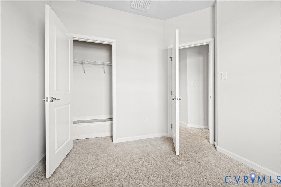 7849 Chasing Lane Richmond, VA 23237 - Photo 27 of 29 Unfurnished bedroom with light colored carpet and