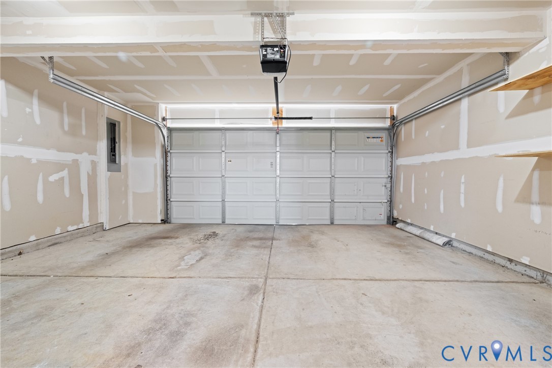 7849 Chasing Lane Richmond, VA 23237 - Photo 29 of 29 Garage with a garage door opener and electric pane
