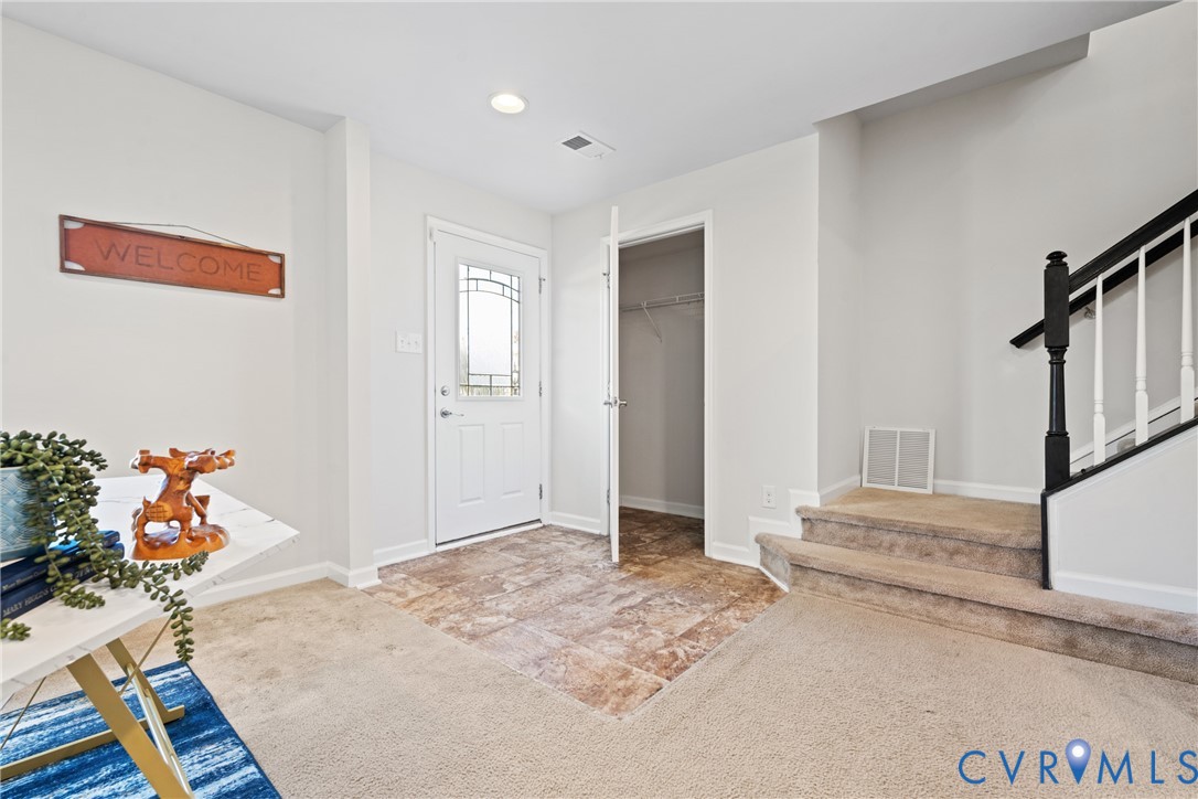 7849 Chasing Lane Richmond, VA 23237 - Photo 7 of 29 Entryway with light carpet, stairs, and recessed l