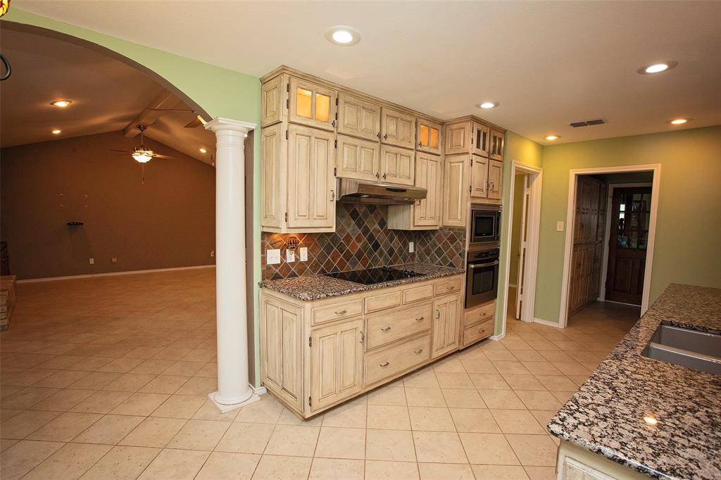 1305 Cliff Drive Graham, TX 76450 - Photo 16 of 37 a large bathroom with a large mirror vanity and shower
