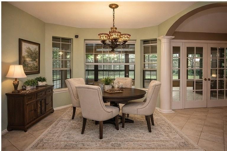 1305 Cliff Drive Graham, TX 76450 - Photo 18 of 37 a dining room with furniture a chandelier and wooden floor