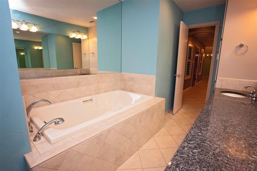 1305 Cliff Drive Graham, TX 76450 - Photo 26 of 32 a bathroom with a tub and shower