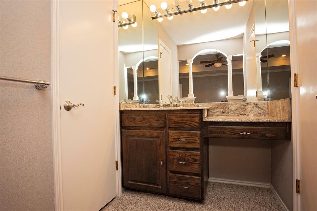 1305 Cliff Drive Graham, TX 76450 - Photo 29 of 37 a bathroom with a granite countertop sink and a mirror