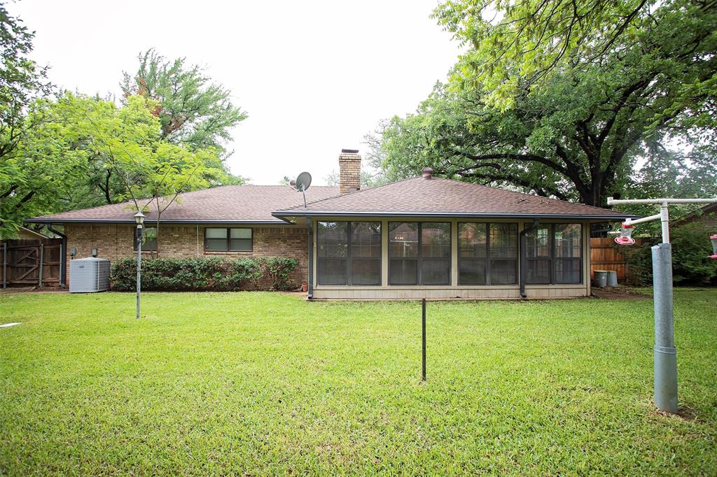 1305 Cliff Drive Graham, TX 76450 - Photo 30 of 32 a view of a house with a yard and sitting area
