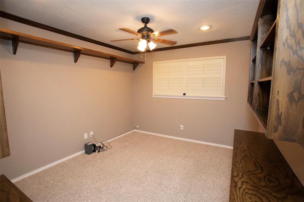 1305 Cliff Drive Graham, TX 76450 - Photo 33 of 37 a view of a livingroom with a ceiling fan and a window