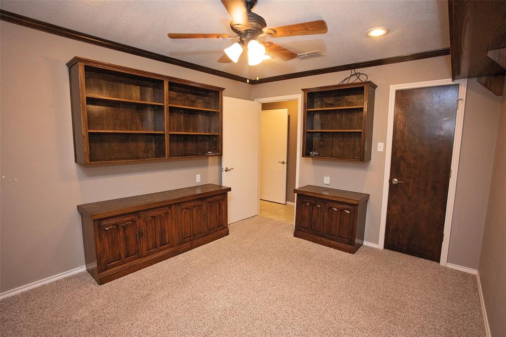 1305 Cliff Drive Graham, TX 76450 - Photo 34 of 37 a view of an empty room with a cabinet and a cabinet