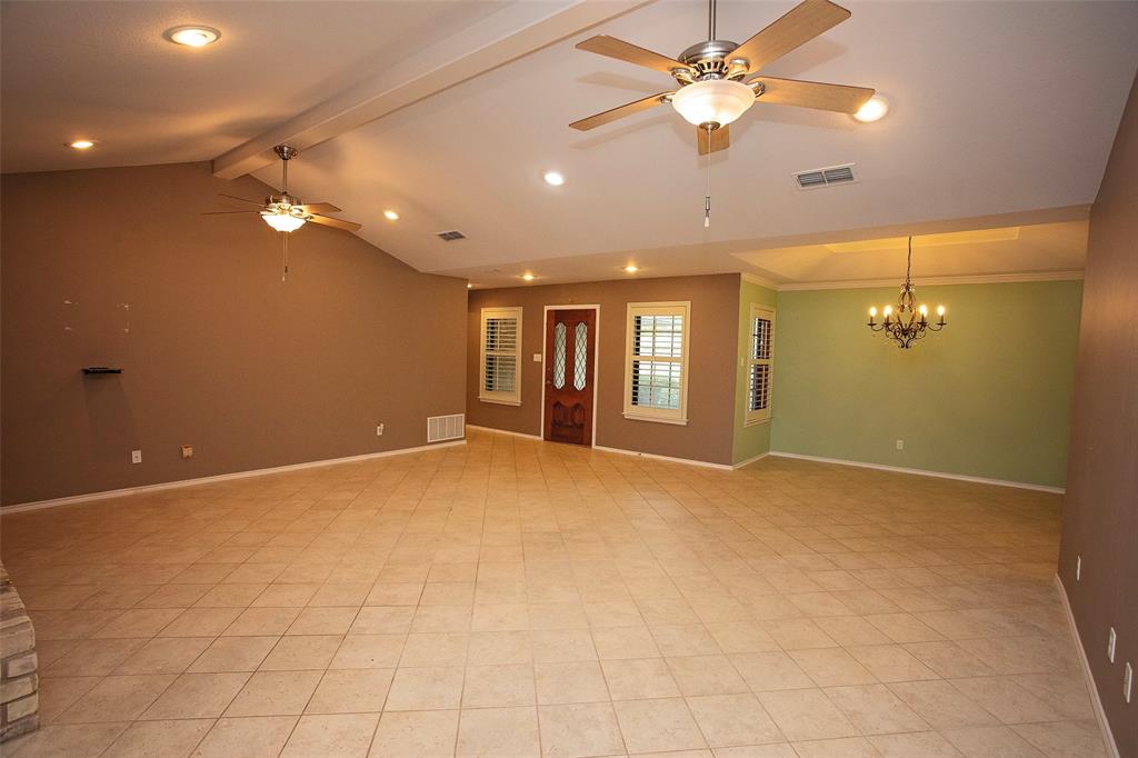 1305 Cliff Drive Graham, TX 76450 - Photo 9 of 32 a view of an empty room with a ceiling fan