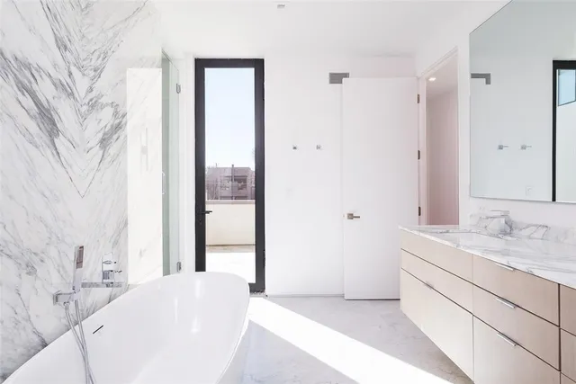 a en suite bathroom with a sink and a mirror