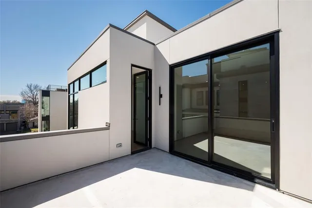 a view of a brick house with a large windows