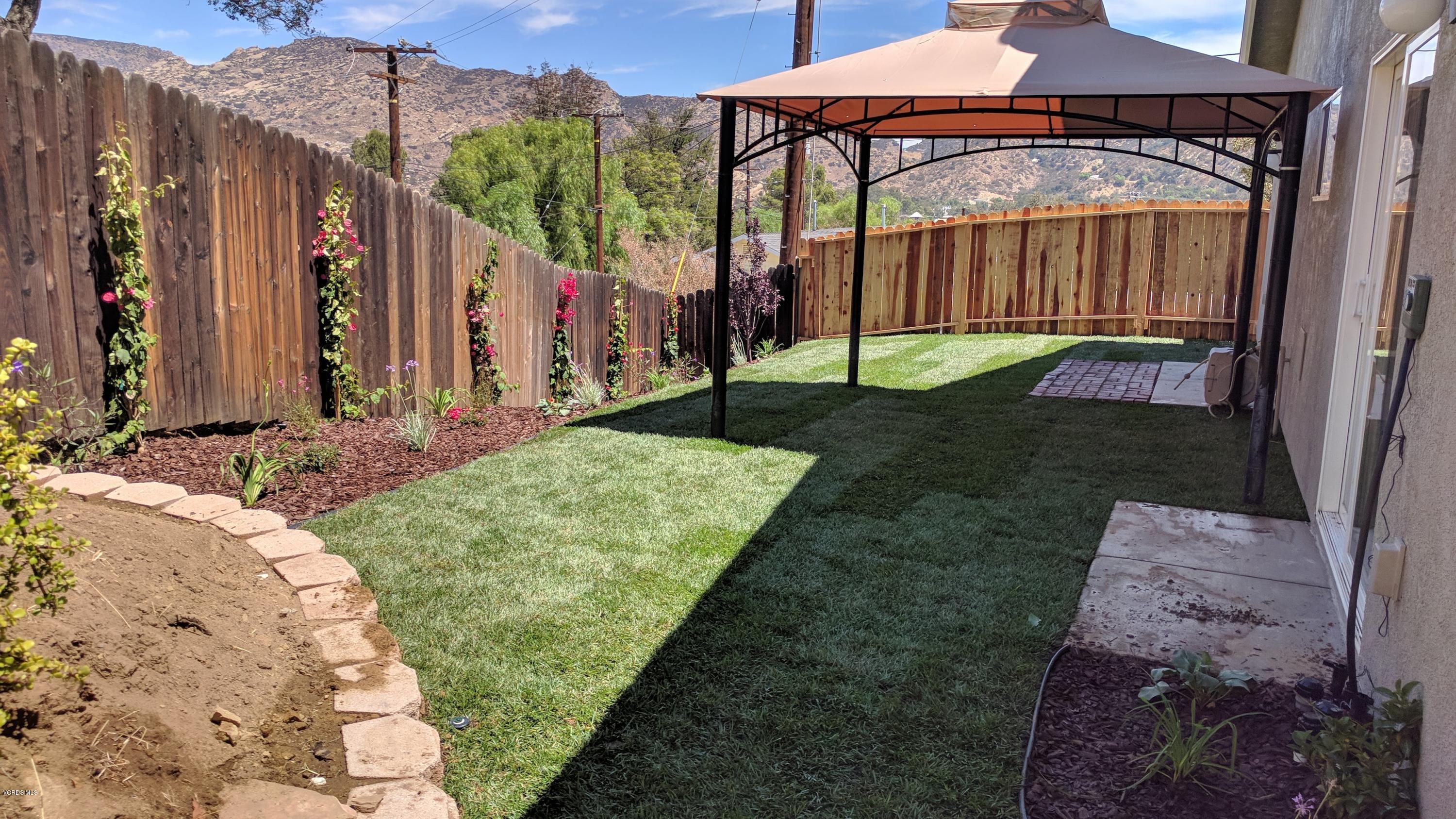 913 Alta Vista Road Simi Valley, CA 93063 - Photo 14 of 25 a view of a back yard of the house