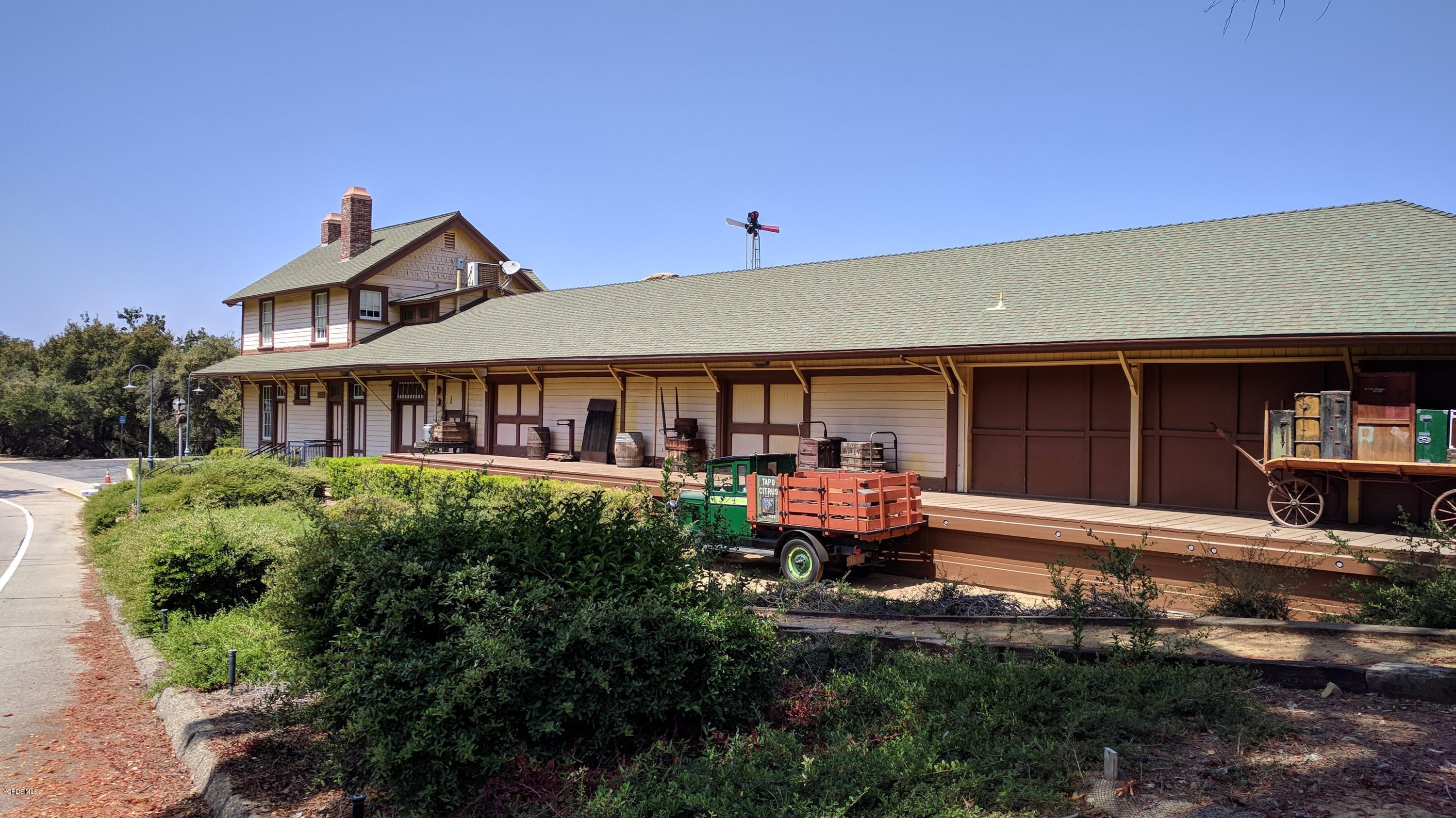 913 Alta Vista Road Simi Valley, CA 93063 - Photo 22 of 25 a front view of a house with a yard fire pit and outdoor seating