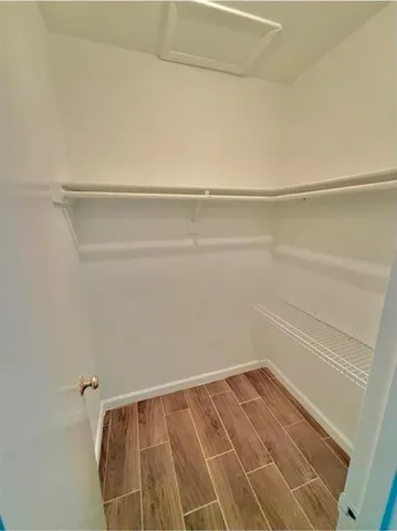 a view of a room with racks on the wall