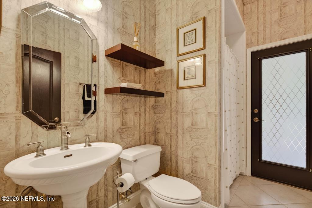 1483 Bridgette Way Fleming Island, FL 32003 - Photo 34 of 63 a bathroom with a sink toilet and shower