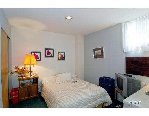 562 West Stratford Place Chicago, IL 60657 - Photo 9 of 10 a bedroom with a bed and a television