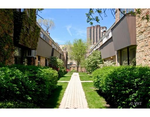562 West Stratford Place Chicago, IL 60657 - Photo 10 of 10 a view of a brick house with a yard and potted plants