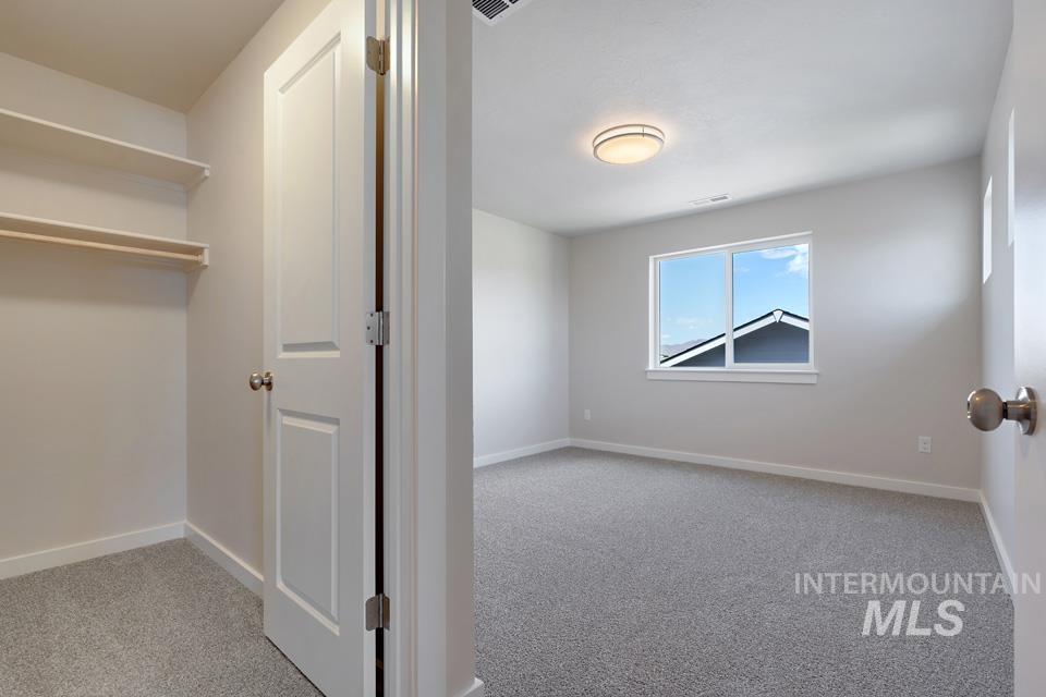 1355 Crescent Street Weiser, ID 83672 - Photo 28 of 31 Unfurnished bedroom with carpet floors and baseboards