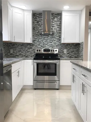 a kitchen with a sink and a microwave oven