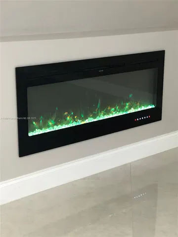 a bathroom with a glass door shower and a sink