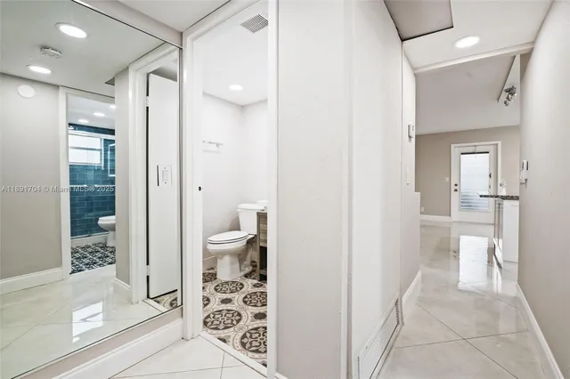 a view of staircase with white walls