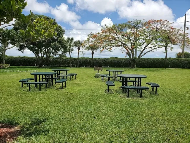 a dining hall with lots of tables and chairs