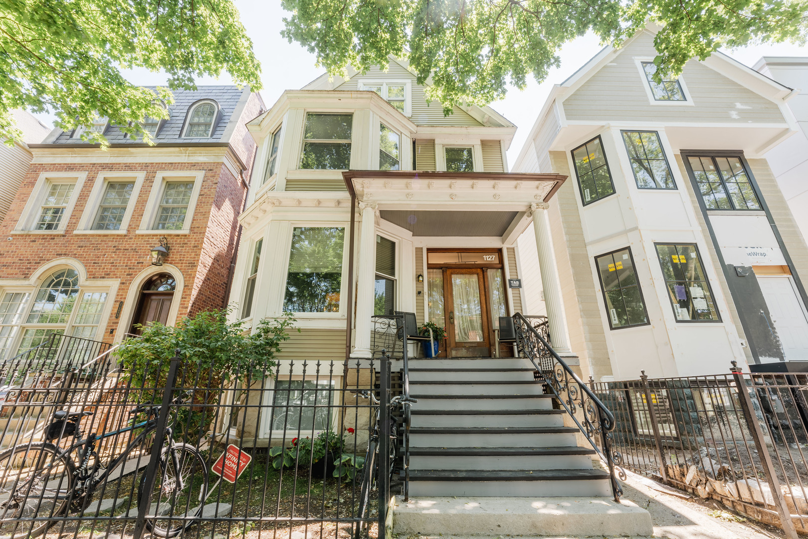a front view of a house with a lots of windows