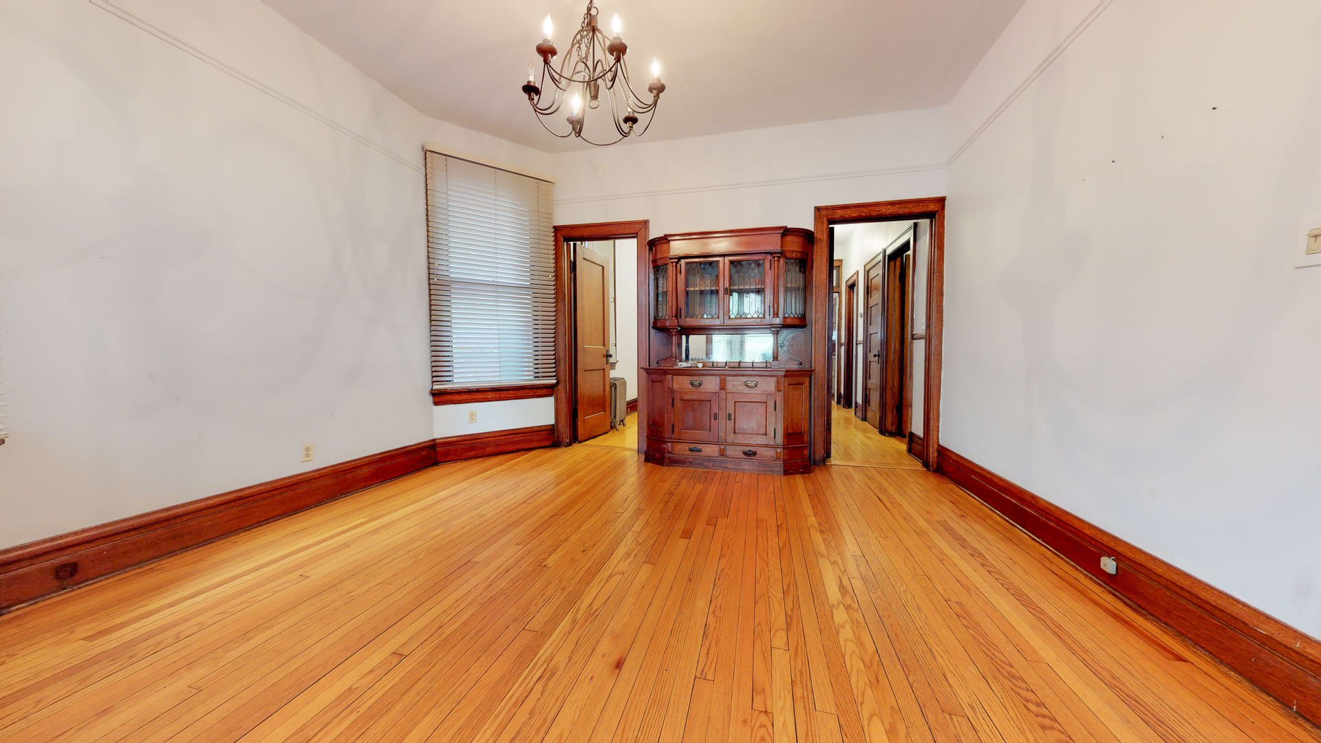 1127 West George Street Chicago, IL 60657 - Photo 12 of 16 a view of a room with wooden floor and wardrobe
