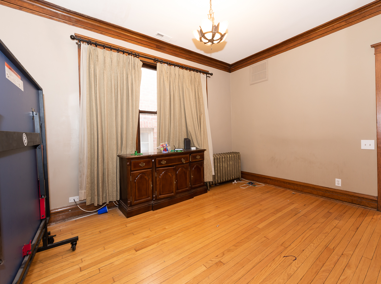 1127 West George Street Chicago, IL 60657 - Photo 6 of 16 a view of a room with wooden floor