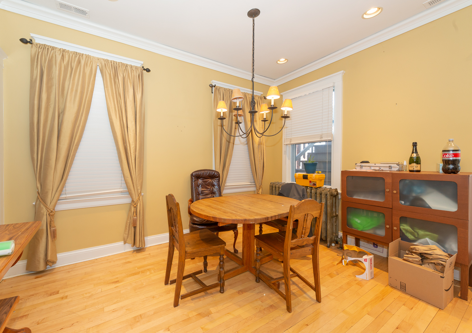 1127 West George Street Chicago, IL 60657 - Photo 8 of 16 a view of a dining room with furniture and a window