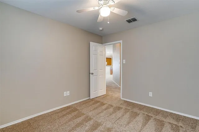 an empty room with a bathroom