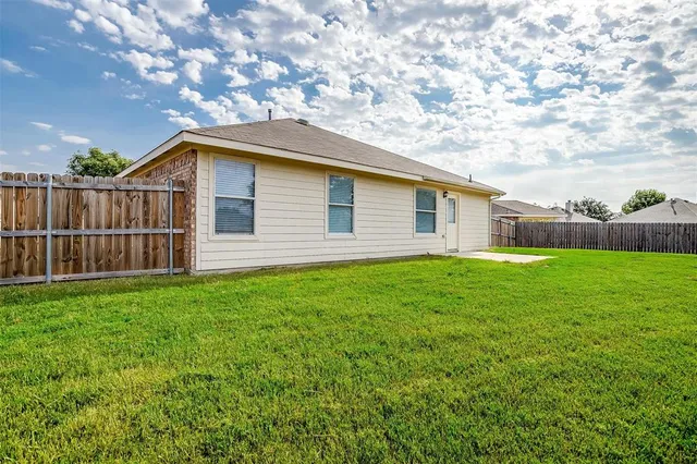 a backyard of a house with lots of green space