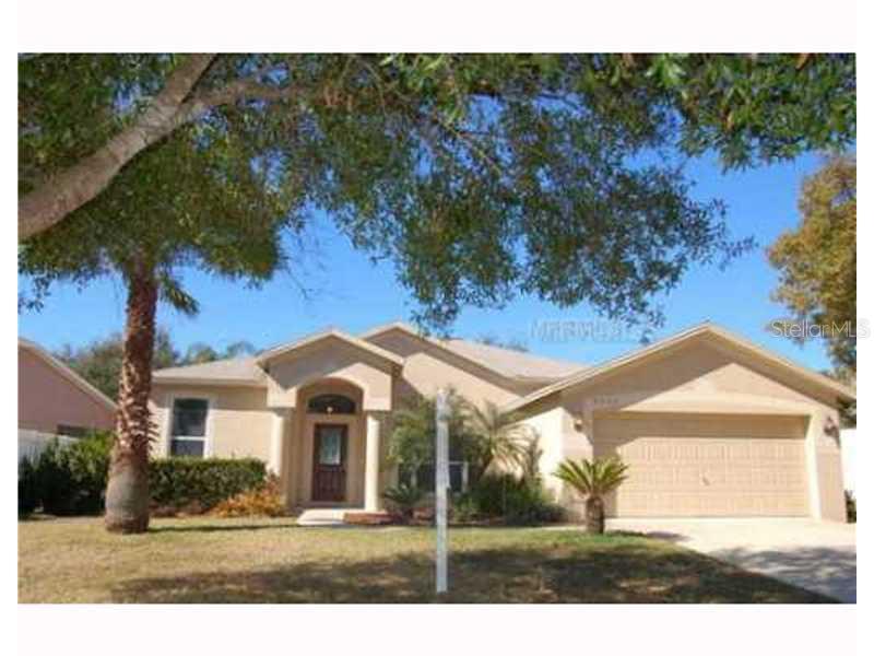 4623 Daventry Place Valrico, FL 33596 - Photo 1 of 1 a front view of a house with a yard and garage