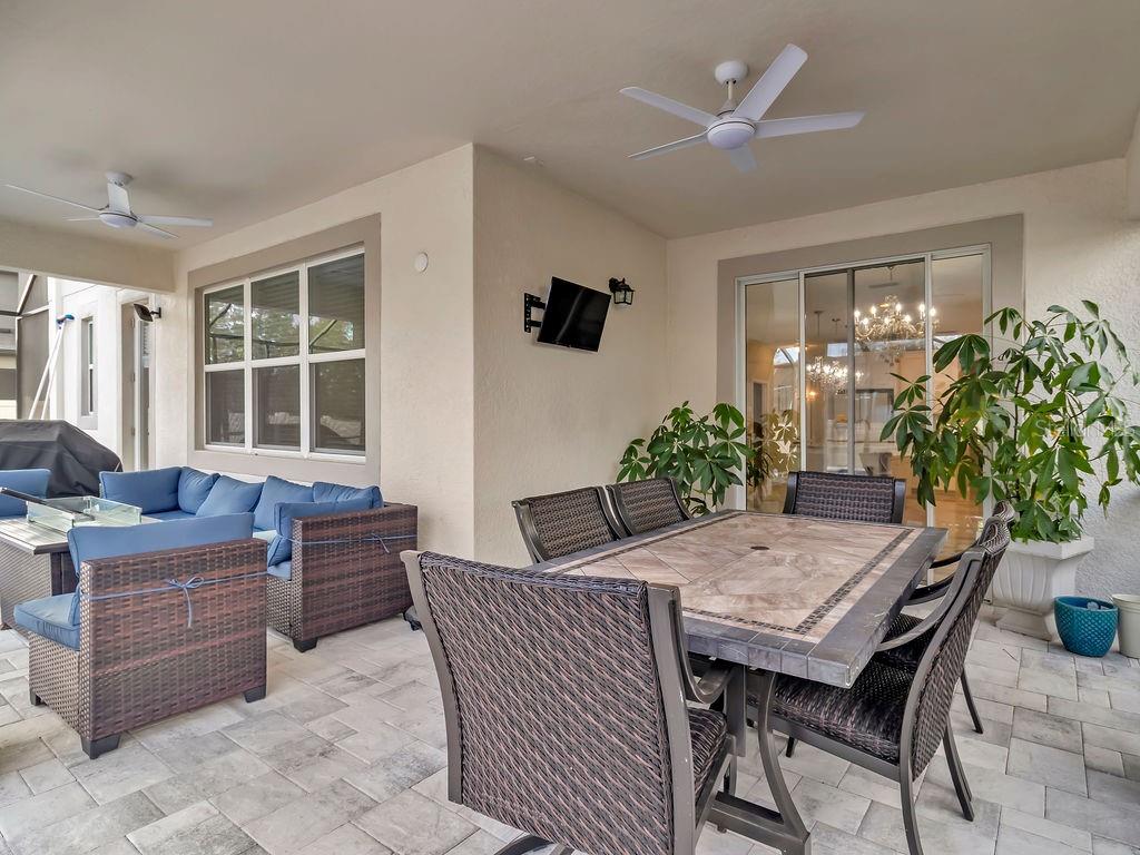 7406 Sweeter Tide Trail Wesley Chapel, FL 33545 - Photo 47 of 74 a dining room with furniture and window or wooden floor