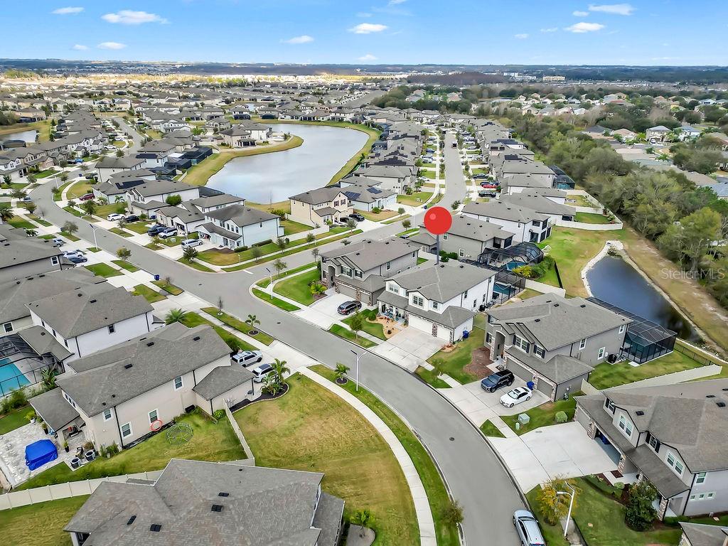7406 Sweeter Tide Trail Wesley Chapel, FL 33545 - Photo 55 of 74 an aerial view of a swimming pool and outdoor space