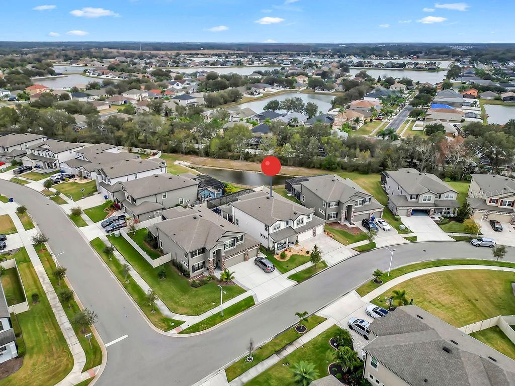 7406 Sweeter Tide Trail Wesley Chapel, FL 33545 - Photo 57 of 74 an aerial view of residential houses with outdoor space
