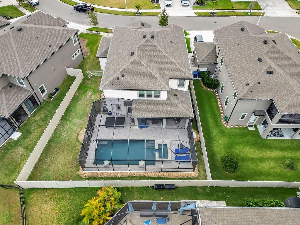 7406 Sweeter Tide Trail Wesley Chapel, FL 33545 - Photo 65 of 74 an aerial view of a house with a yard