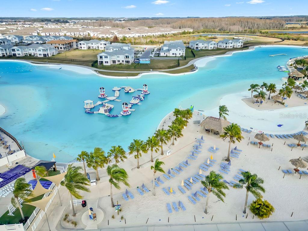 7406 Sweeter Tide Trail Wesley Chapel, FL 33545 - Photo 67 of 74 an aerial view of a city with ocean view