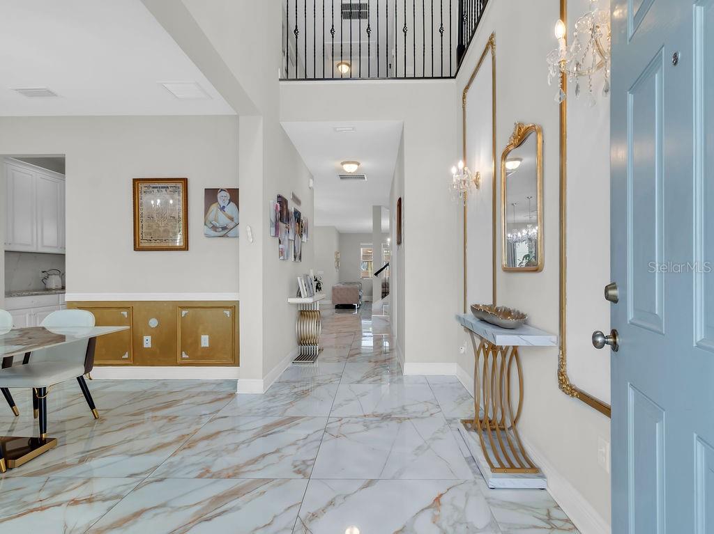 7406 Sweeter Tide Trail Wesley Chapel, FL 33545 - Photo 7 of 74 a living room with furniture and a wooden floor