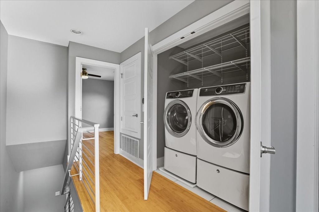 6902 Bennett Avenue, Unit B Austin, TX 78752 - Photo 15 of 27 Laundry area featuring light wood-style floors, washing machine and dryer, and ceiling fan