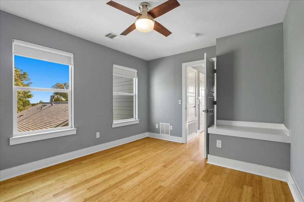 6902 Bennett Avenue, Unit B Austin, TX 78752 - Photo 16 of 27 Spare room featuring light wood-style flooring and a ceiling fan