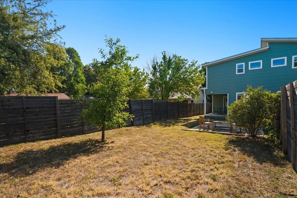 6902 Bennett Avenue, Unit B Austin, TX 78752 - Photo 22 of 27 Fenced backyard featuring a patio area