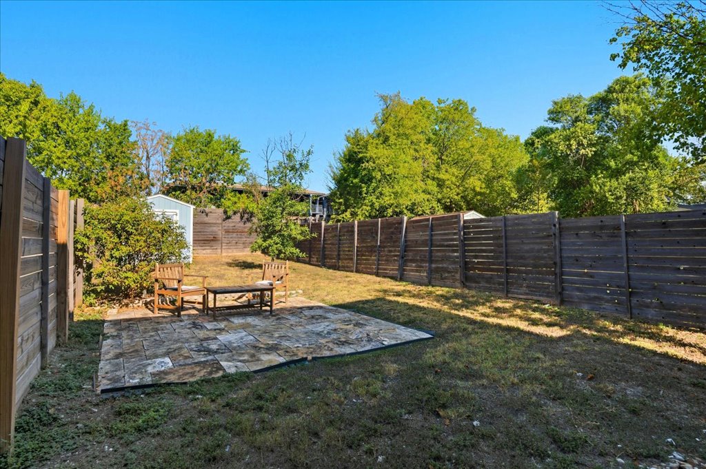 6902 Bennett Avenue, Unit B Austin, TX 78752 - Photo 24 of 27 Fenced backyard featuring a patio