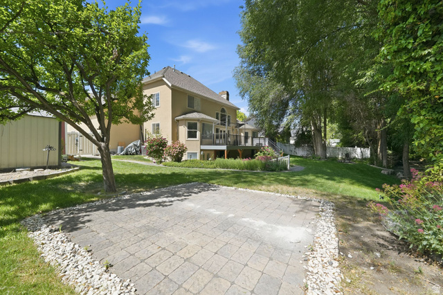 883 East 700 South Springville, UT 84663 - Photo 48 of 59 Expansive backyard featuring a paver patio, manicured lawn, mature trees, and a multi-level deck
