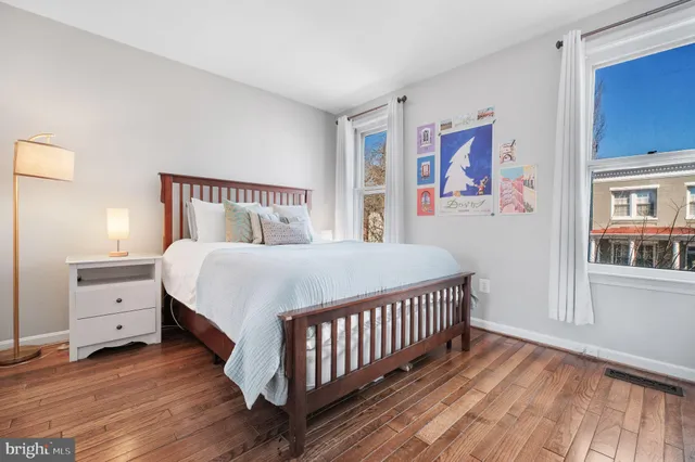 a bed room with a bed and a window