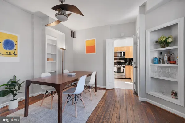 a view of a dining room with furniture and wooden floor