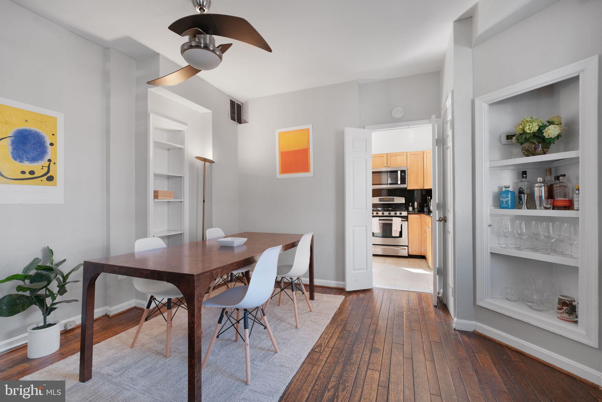 3256 Q Street Northwest Washington, DC 20007 - Photo 4 of 20 a view of a dining room with furniture and wooden floor
